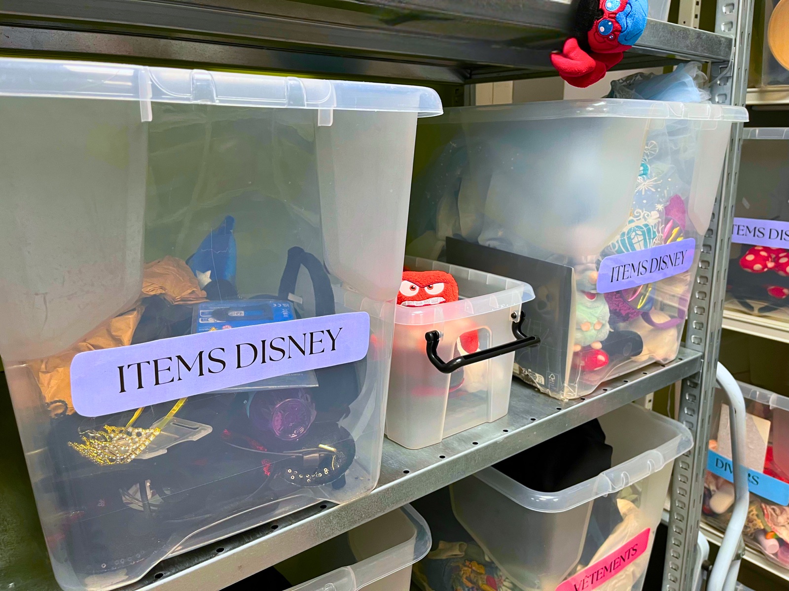 Bins of unclaimed Disney merchandise and accessories sorted for reuse at Disneyland Paris