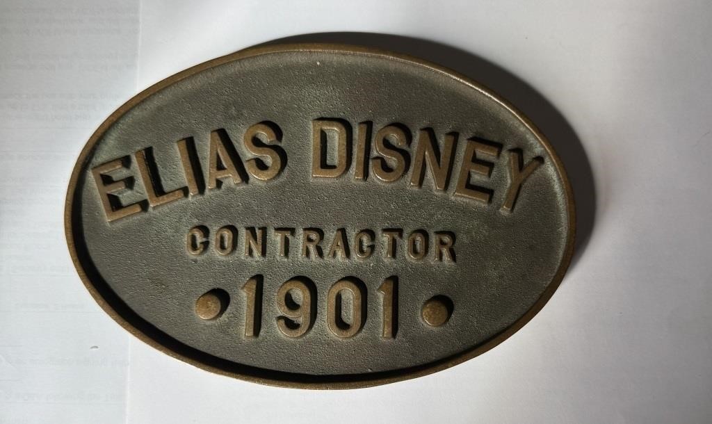 Cast brass plaque reading Elias Disney Contractor 1901