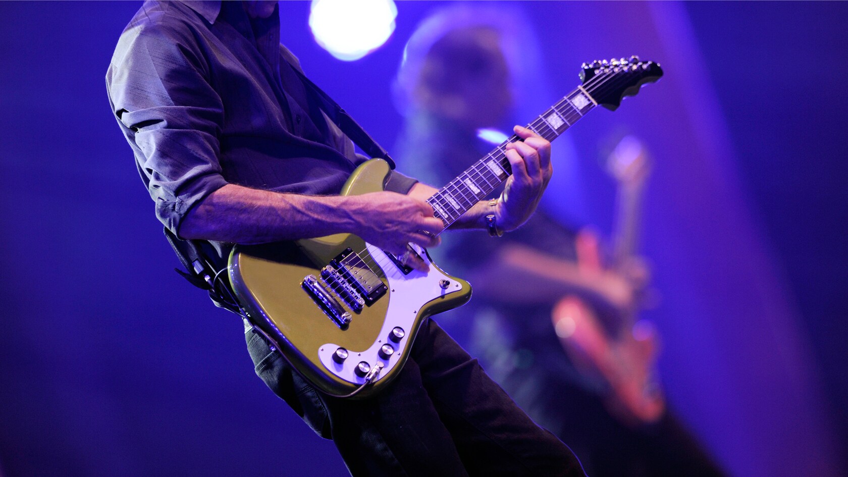 A guitarist performing during the Eat to the Beat concert series at EPCOT