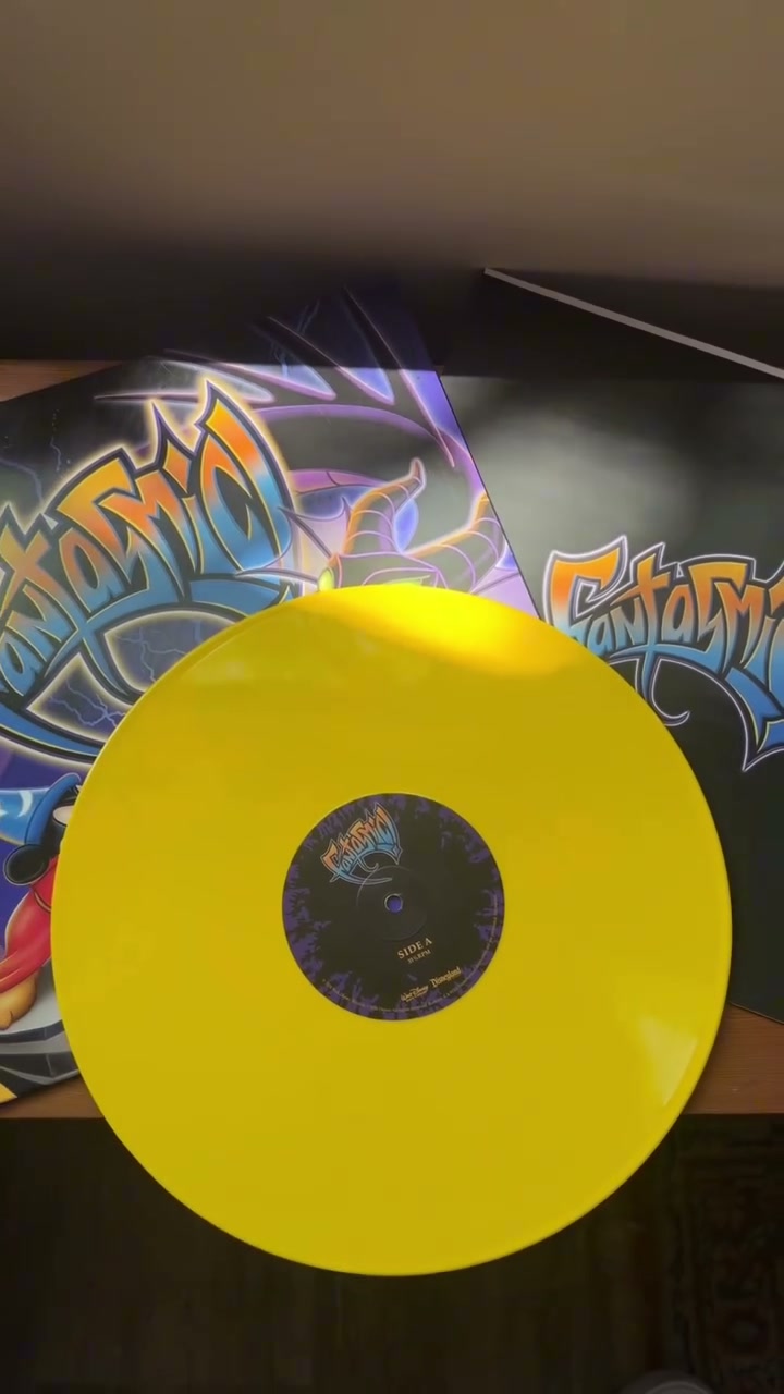 Fantasmic! album sleeve beside an opaque yellow vinyl record