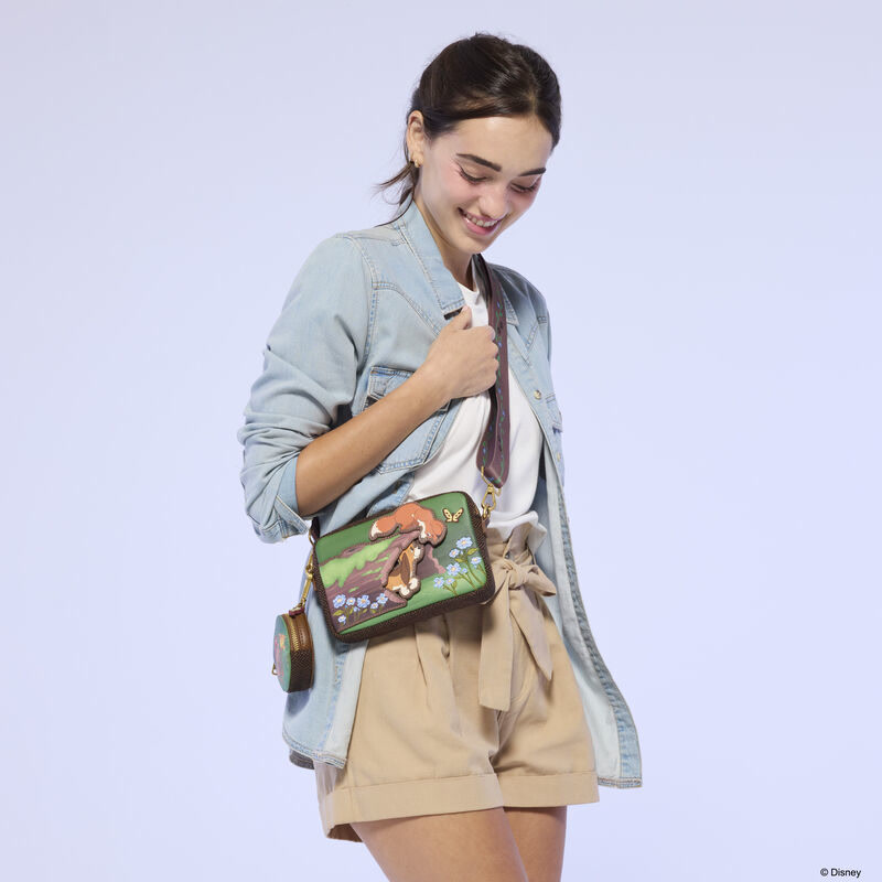 Model wearing the Fox and the Hound sling bag
