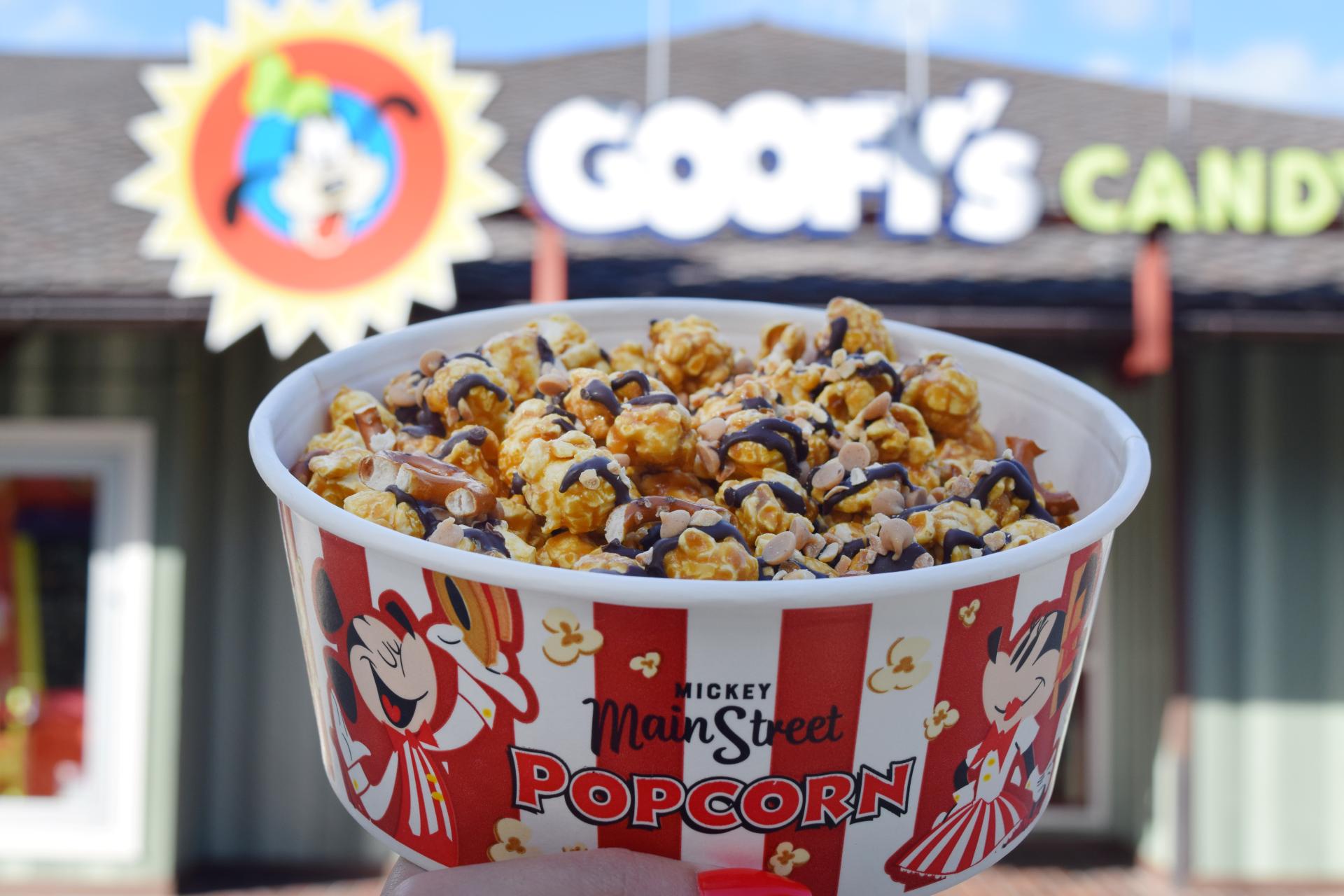 Popcorn bags and toppings for the create-your-own popcorn station at Goofy's Candy Company