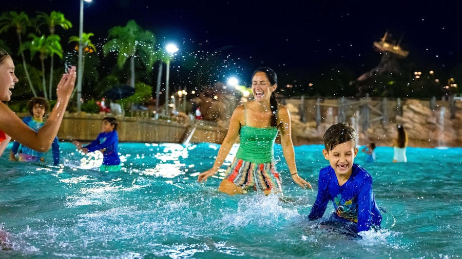 Guests dance during Disney H2O Glow After Hours at Typhoon Lagoon
