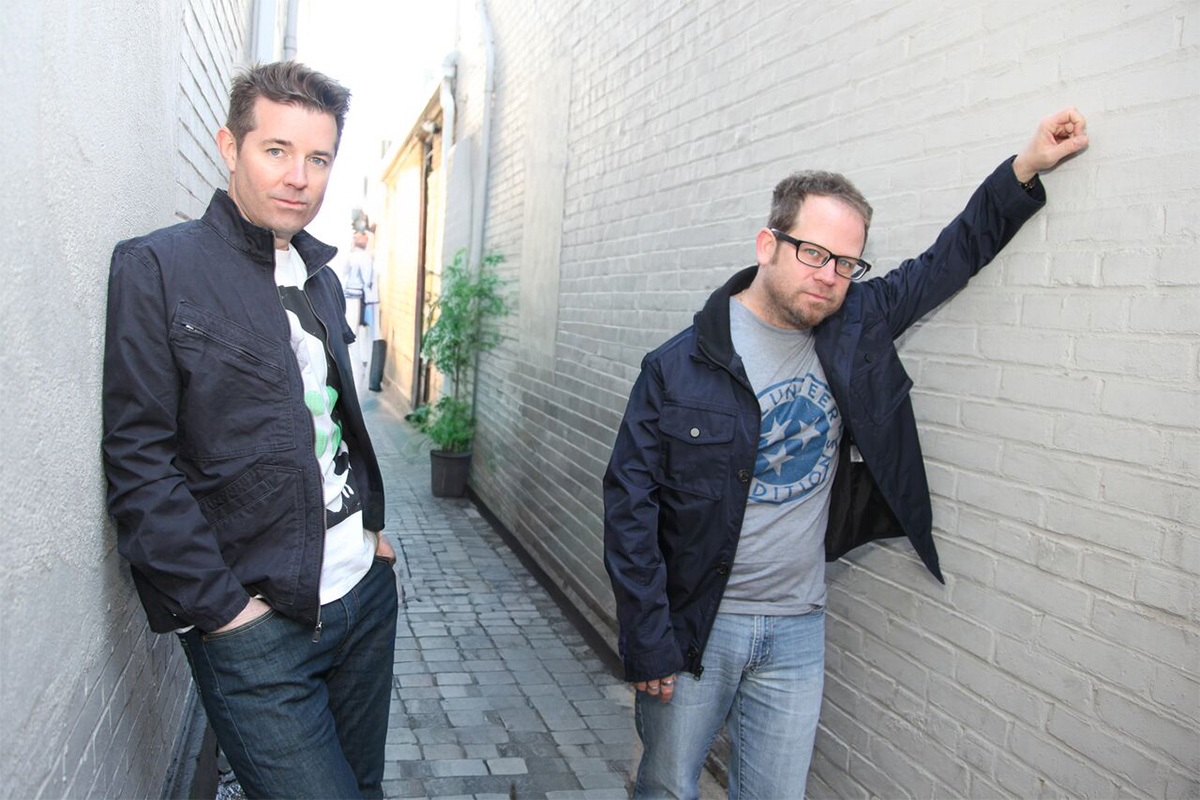 Nine Days members John Hampson and Brian Desveaux standing in an alley