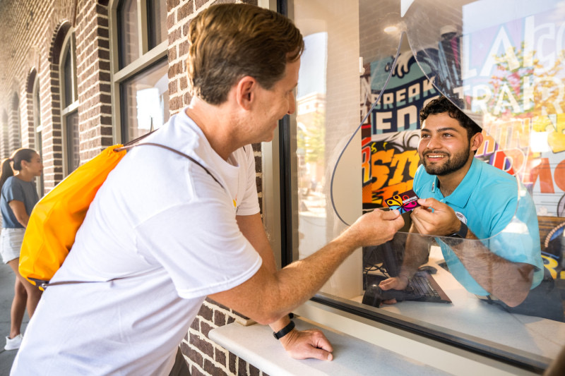 A passholder at Guest Services.