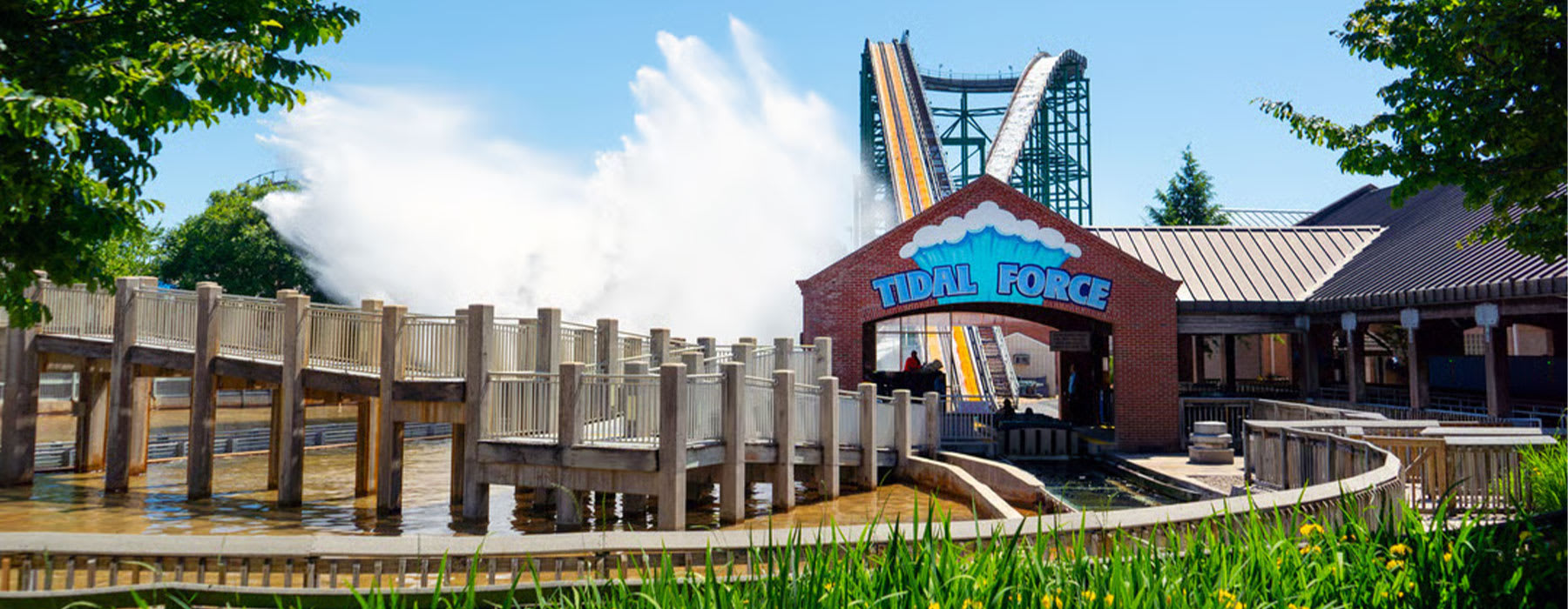 A large splash rises as Tidal Force reaches the bottom of its drop at Hersheypark