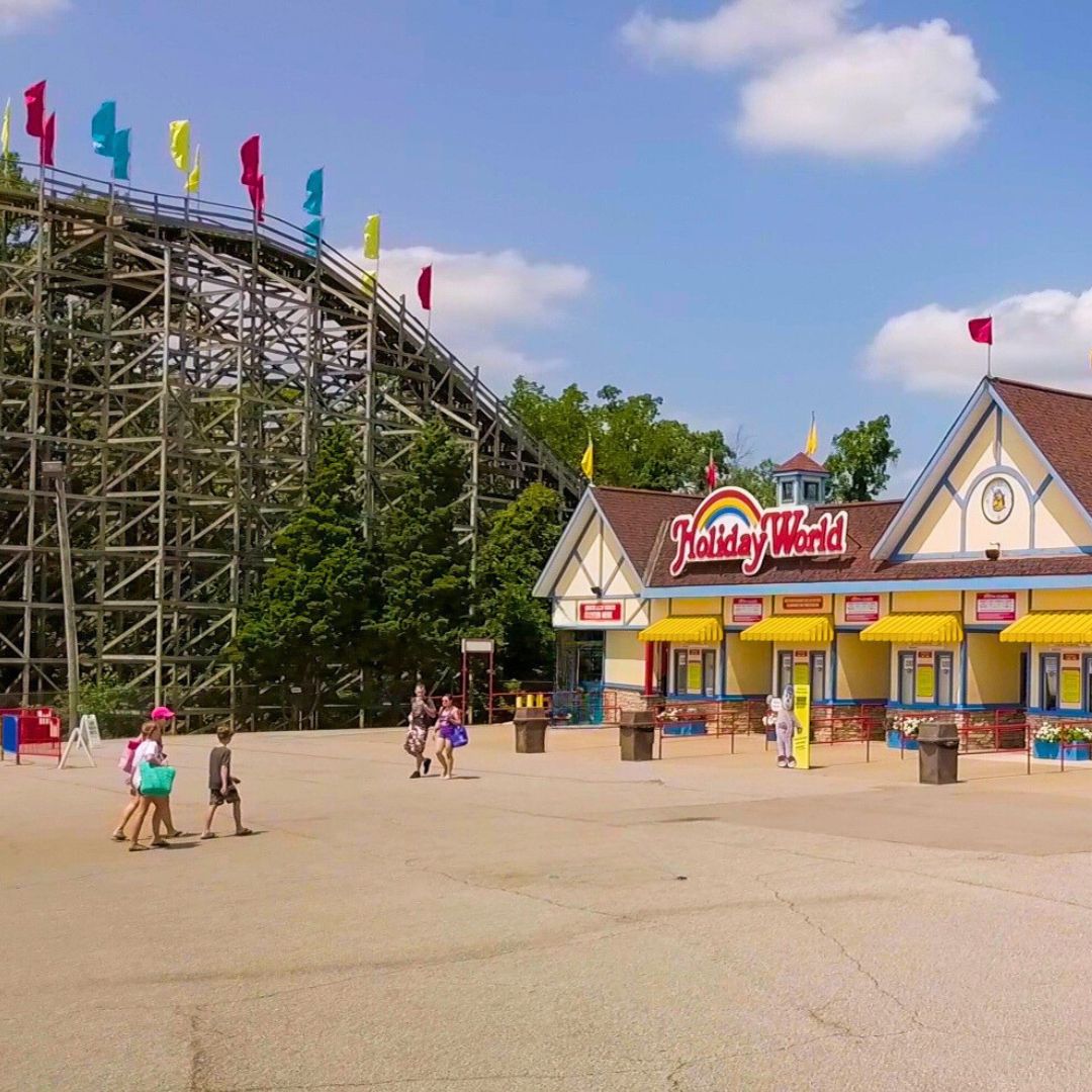 Holiday World entrance beside a wooden roller coaster