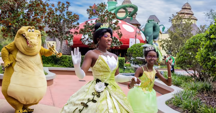 Princess Tiana, Louis and a child at Give Kids The World Village