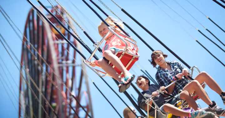 Guests ride Silly Symphony Swings at Disney California Adventure
