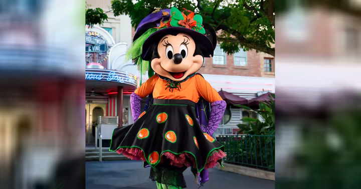 Minnie Mouse in Halloween attire outside Hollywood & Vine at Disney’s Hollywood Studios