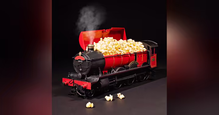 Steam-producing Hogwarts Express popcorn bucket filled with popcorn