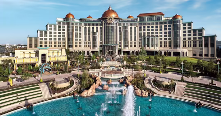 Universal Helios Grand Hotel above the gardens and fountains of Celestial Park