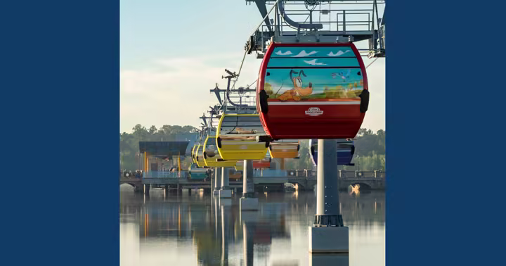 Guests riding the Disney Skyliner over Walt Disney World