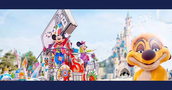 Timon beside Mickey and Minnie on a colorful A Million Splashes of Colour float near Sleeping Beauty Castle