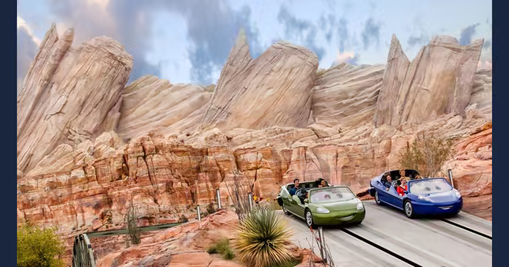 Official Disneyland Resort photograph of two Radiator Springs Racers cars beside the Cadillac Range