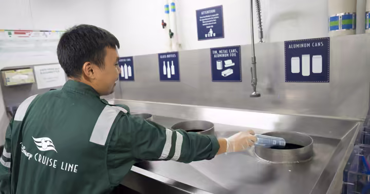 Disney Cruise Line crew member sorts recyclables in a shipboard recycling room