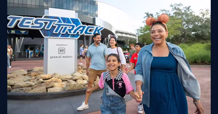A family walking outside Test Track at EPCOT