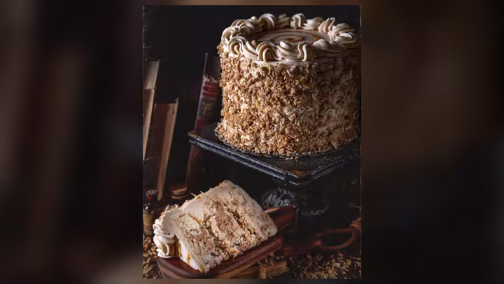 Gideon’s Baklava Cake Slice with walnuts, phyllo and honey buttercream