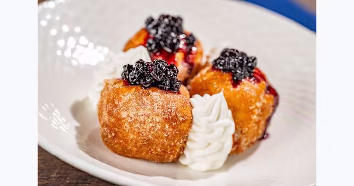 Stuffed French toast with berry compote and cream at Ale and Compass Restaurant