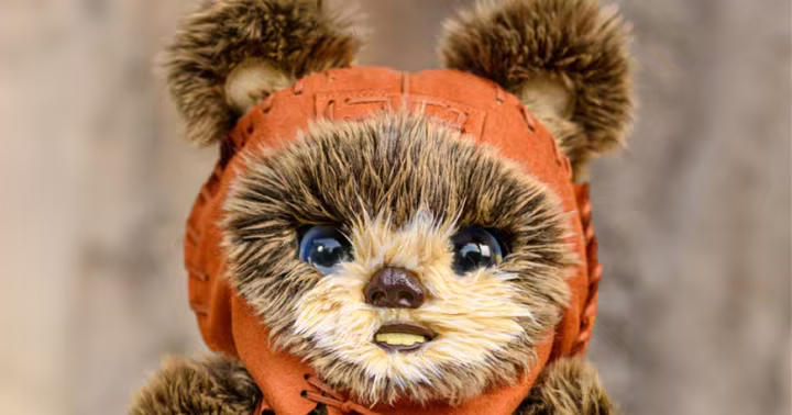 The interactive Batuu Adventure Buddies Ewok wearing an orange hood