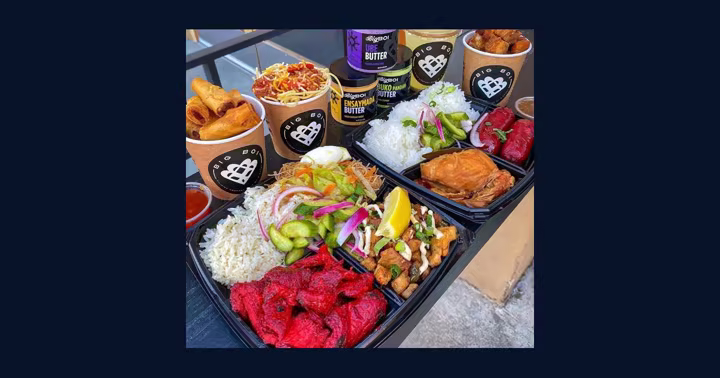 Big Boi Filipino food spread with branded lumpia cups, rice plates, sauces, and ube butter jars
