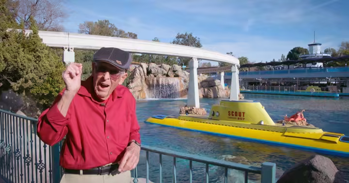 Bob Gurr beside the Finding Nemo Submarine Voyage lagoon at Disneyland