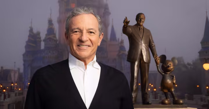 Bob Iger at Walt Disney World with the Partners statue and Cinderella Castle behind him