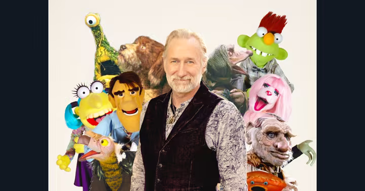 Brian Henson surrounded by puppets from Jim Henson Company productions