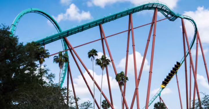 Kumba train climbing through the green track and red supports at Busch Gardens Tampa Bay