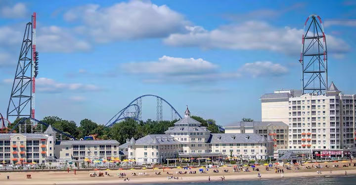 Cedar Point resort guests walk near a Lake Erie hotel setting