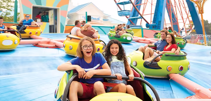 A family walking down the Cedar Point midway