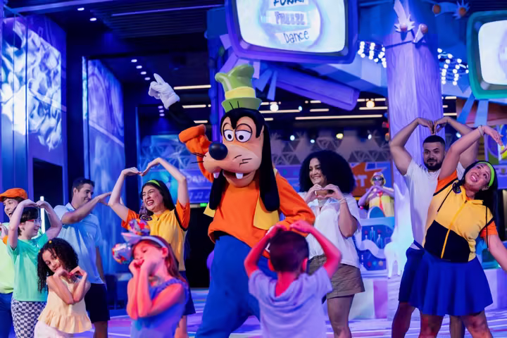 Goofy dances inside CommuniCore Hall for Cool KIDS' SUMMER at EPCOT