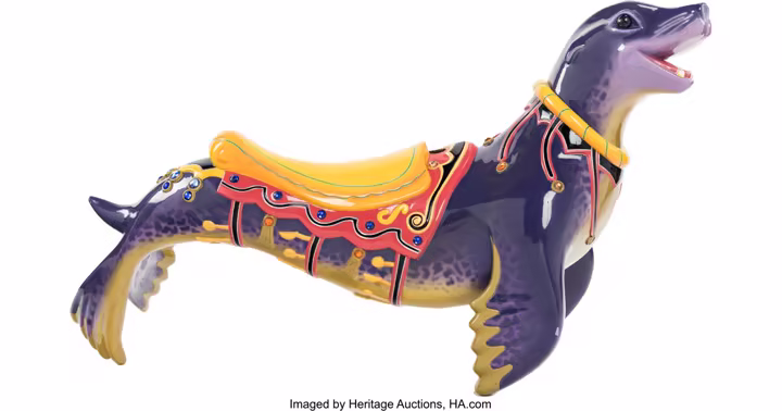 Purple sea lion attraction vehicle from King Triton's Carousel in the Disney Experiences Auction