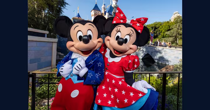 Mickey Mouse and Minnie Mouse in patriotic outfits at Magic Kingdom