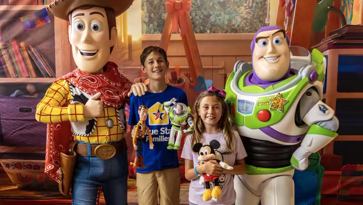 Woody and Buzz Lightyear pose with Blue Star Families children at a Toy Story 5 screening at Camp Pendleton