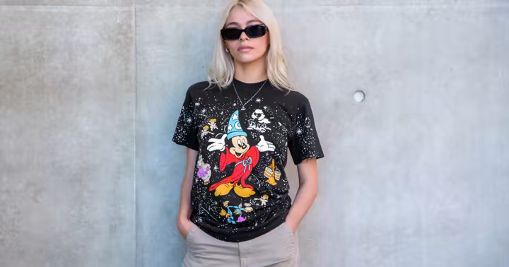 Model wearing a black Sorcerer's Apprentice Mickey shirt from Disney and Bobby Kim