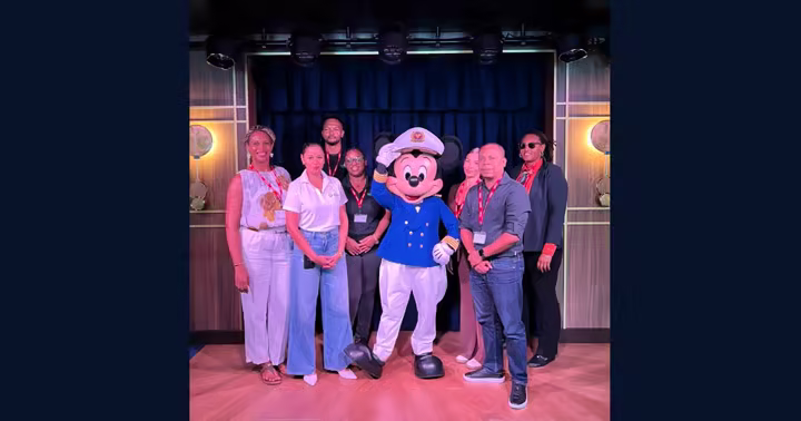 Mickey Mouse in a Disney Cruise Line captain outfit with St. Maarten officials aboard Disney Destiny