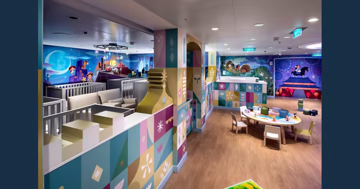 It’s a Small World Nursery aboard the Disney Destiny, with cribs and a play table