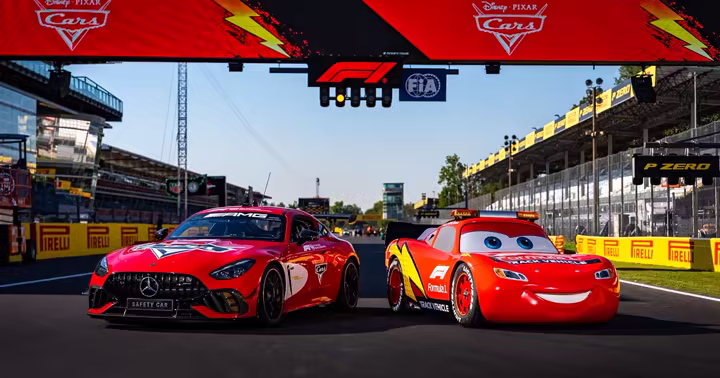 Lightning McQueen beside a Cars-inspired Mercedes-AMG Formula 1 Safety Car at Monza