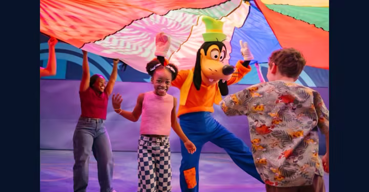 Goofy dances with kids during Walt Disney World's Cool KIDS' SUMMER campaign