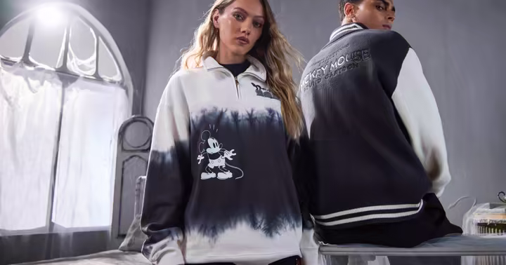 Models wearing apparel from Disney Store's Skeleton Dance Halloween collection
