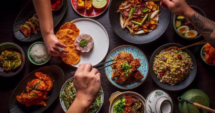 A table filled with dishes for Visit Orlando's Magical Dining