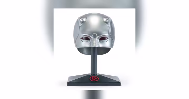 Silver Daredevil mask on its display stand
