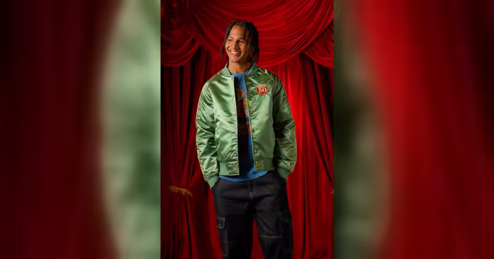 Green satin The Muppet Show 50th Anniversary jacket shown on a model
