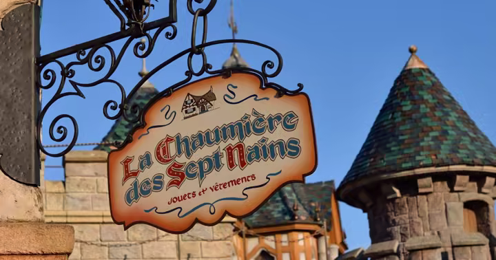 The Blanche-Neige et les Sept Nains attraction sign in Fantasyland at Disneyland Paris