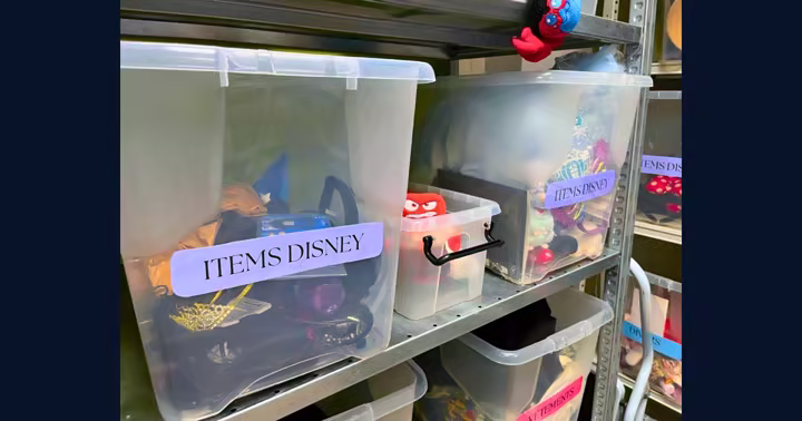 Bins of unclaimed Disney merchandise and accessories sorted for reuse at Disneyland Paris
