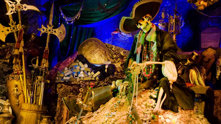 Skeleton pirate sitting on cursed treasure inside Pirates of the Caribbean at Disneyland Park