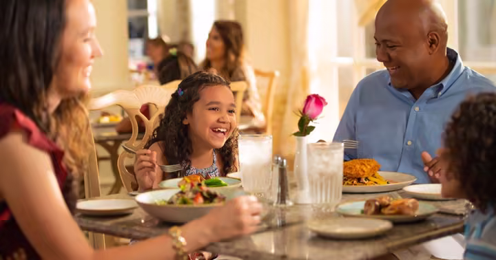 A family dining at Grand Floridian Cafe at Walt Disney World Resort