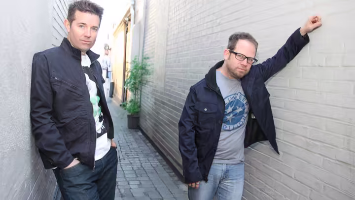 Nine Days members John Hampson and Brian Desveaux standing in an alley