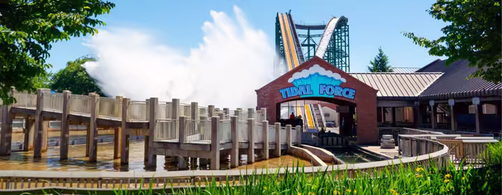 A large splash rises as Tidal Force reaches the bottom of its drop at Hersheypark